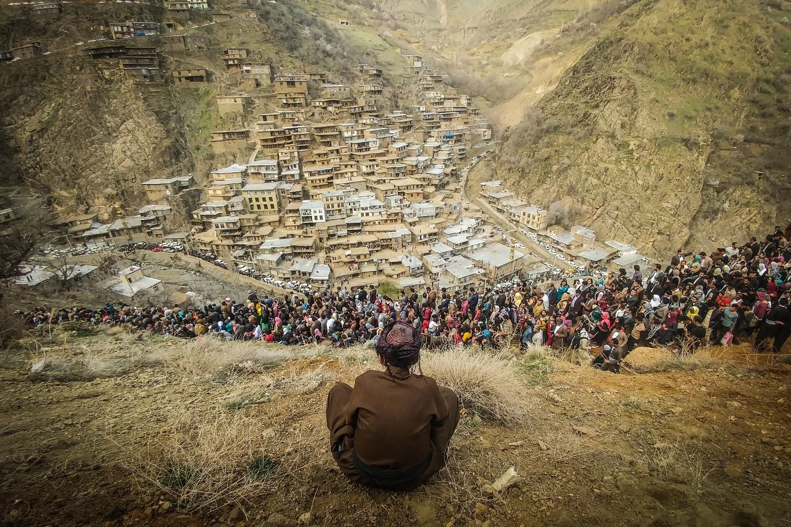 Man overlooks the Nowruz festival in Iran