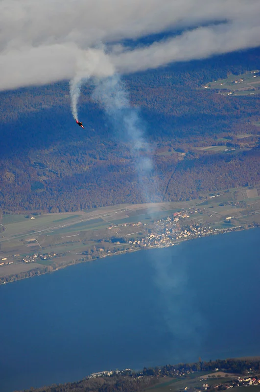 Swiss 'Jetman' Yves Rossy has successfully performed two aerial loops, using his unique strap-on jet-powered wing