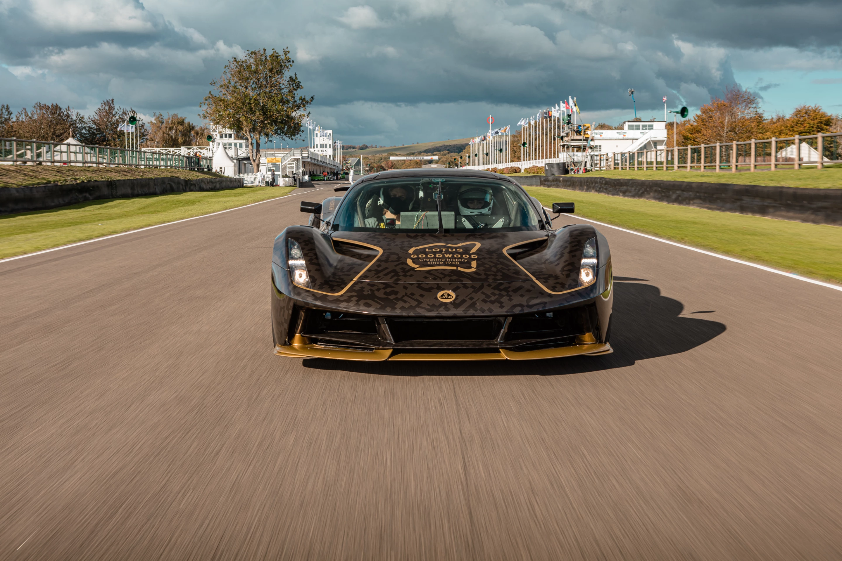 On the hood of the Lotus Evija at Goodwood is a tribute to the festival and Lotus' long history with it