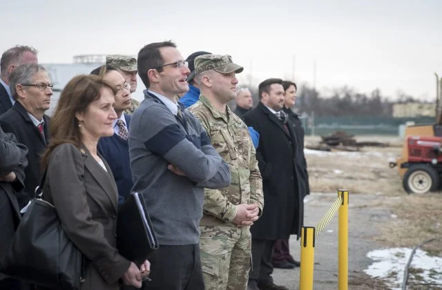Officials watch on as the US Army's 'hoverbike' takes flight