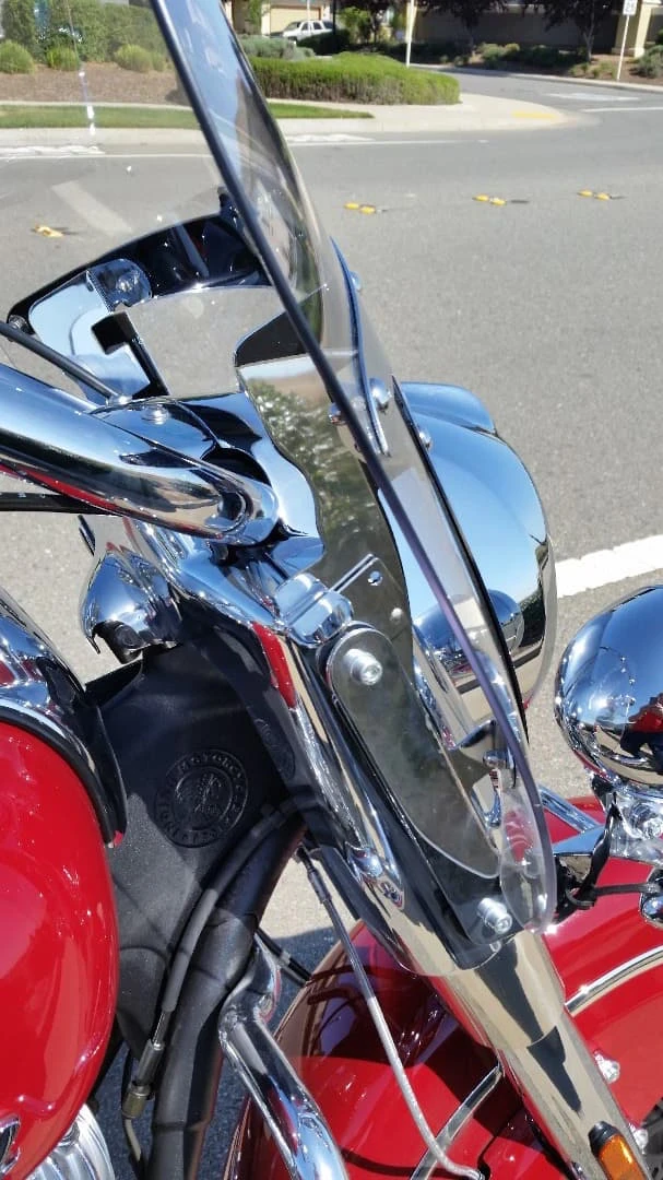 A side clamp on either side of the windshield allows for quick release