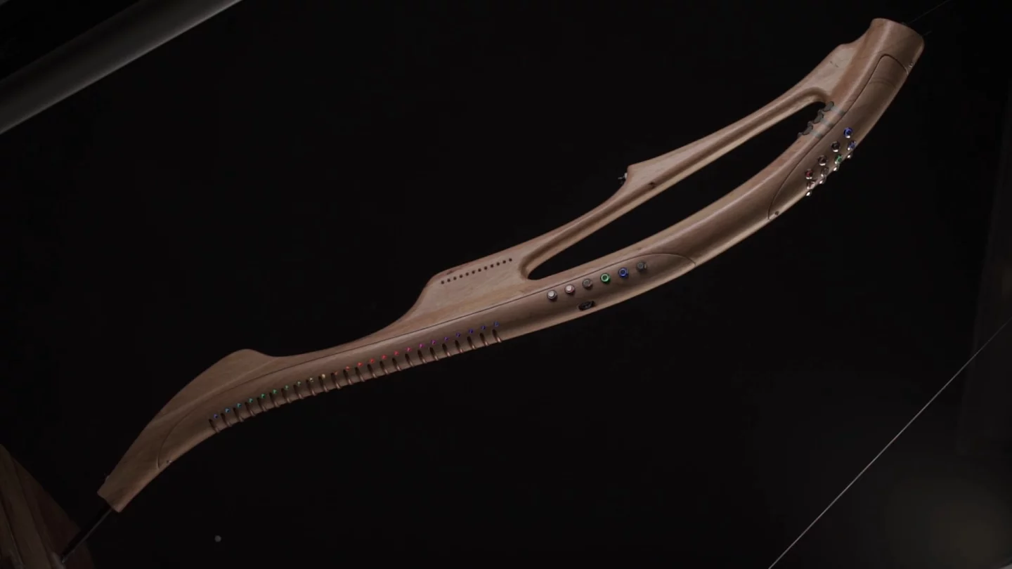 The 120 cm (47 in) long, 5 kg (11 lb) instrument is made of hardwood and combines high-end electronics, smart algorithms and an eye-catching, ergonomic design