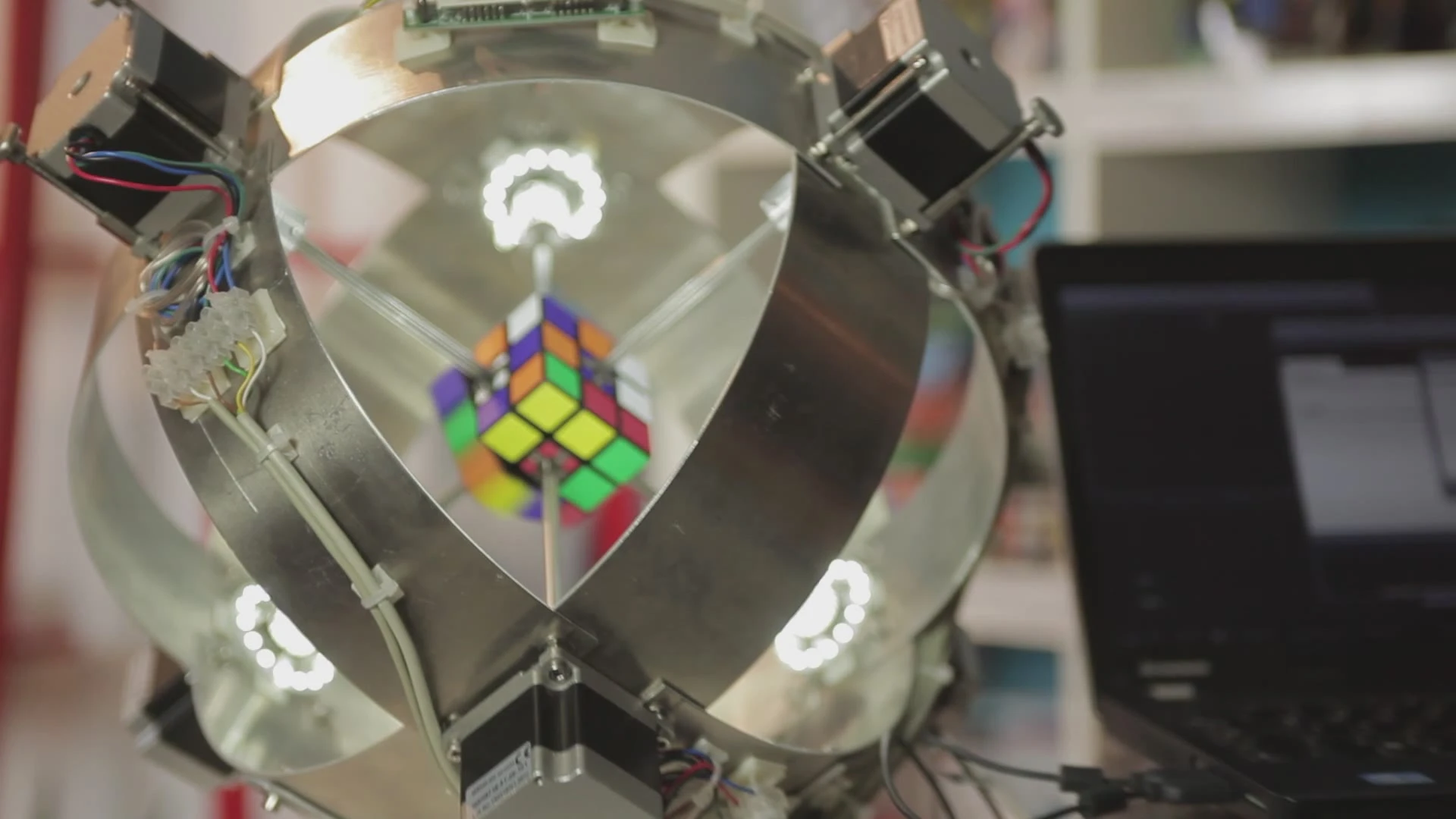 The cube was scrambled by a computer generated random array before being positioned in the robot