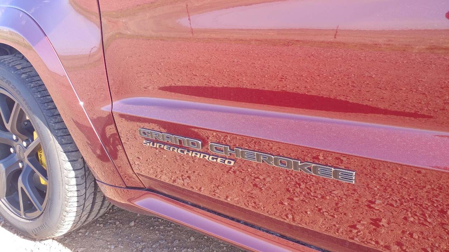 Just in case onlookers weren't sure by the pipe rumble, the Jeep Grand Cherokee Trackhawk prominently labels itself "Supercharged" along the doors
