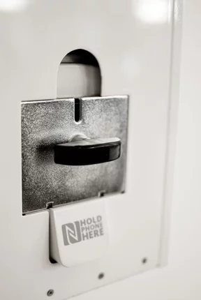 Deliciously retro-looking coin slot lever to the front of the Digital Gum Machine waiting for a 50 cent coin