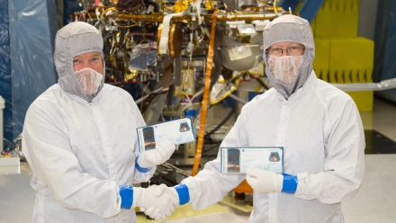 InSight project manager Tom Hoffman and principal investigator Bruce Banerdt pose with their "boarding passes"