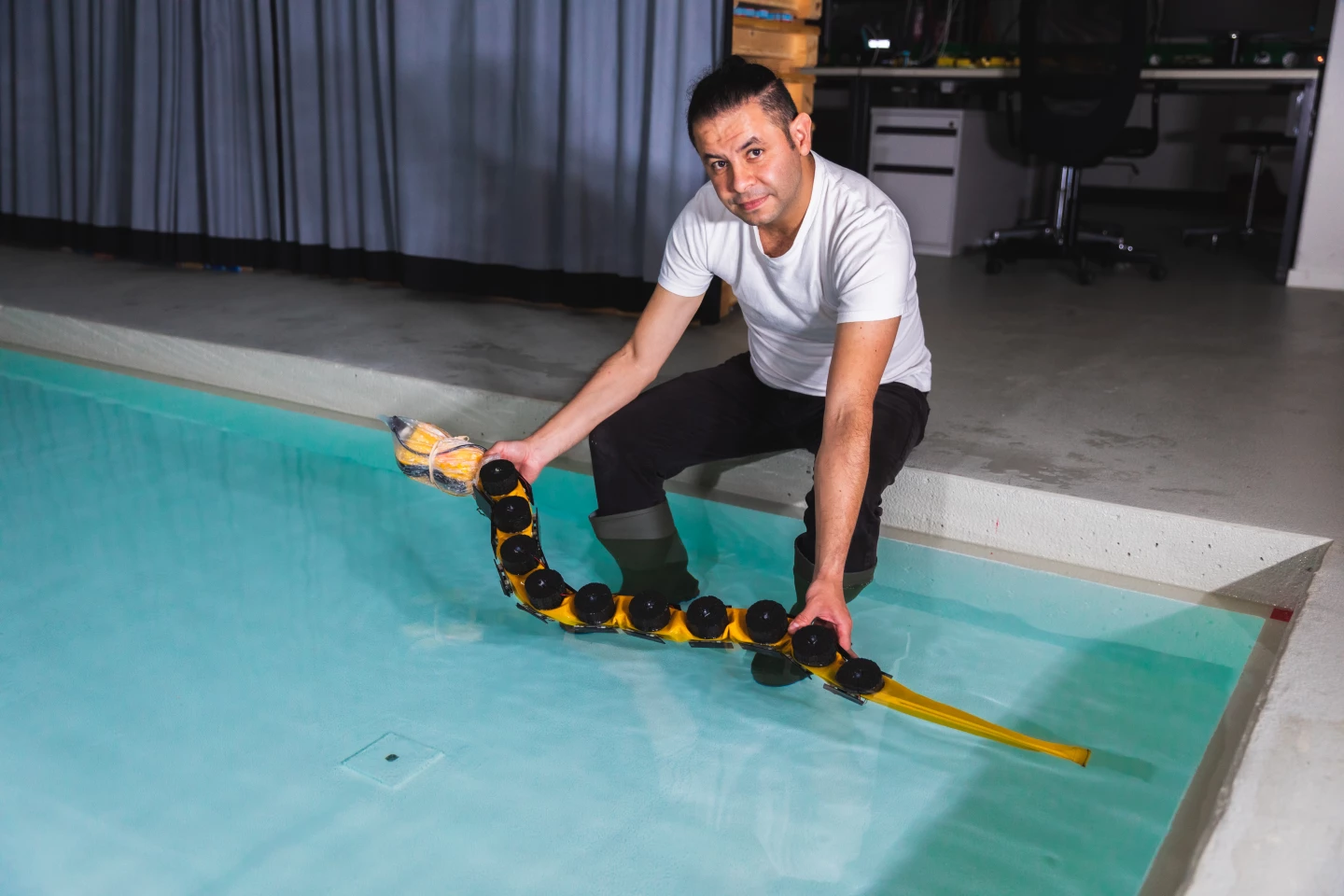 Dr. Kamilo Melo with AgnathaX at the EPFL pool