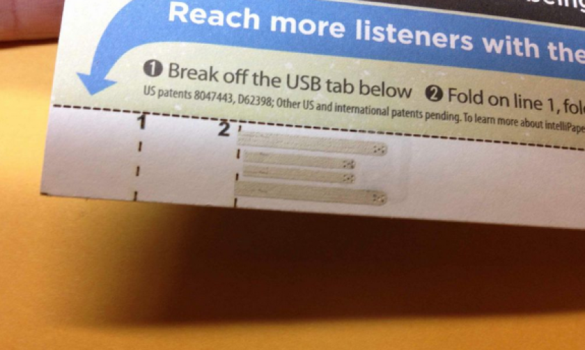 Once it's ripped from the full sheet and folded in half, the paper can be inserted into any USB port to access the files it holds