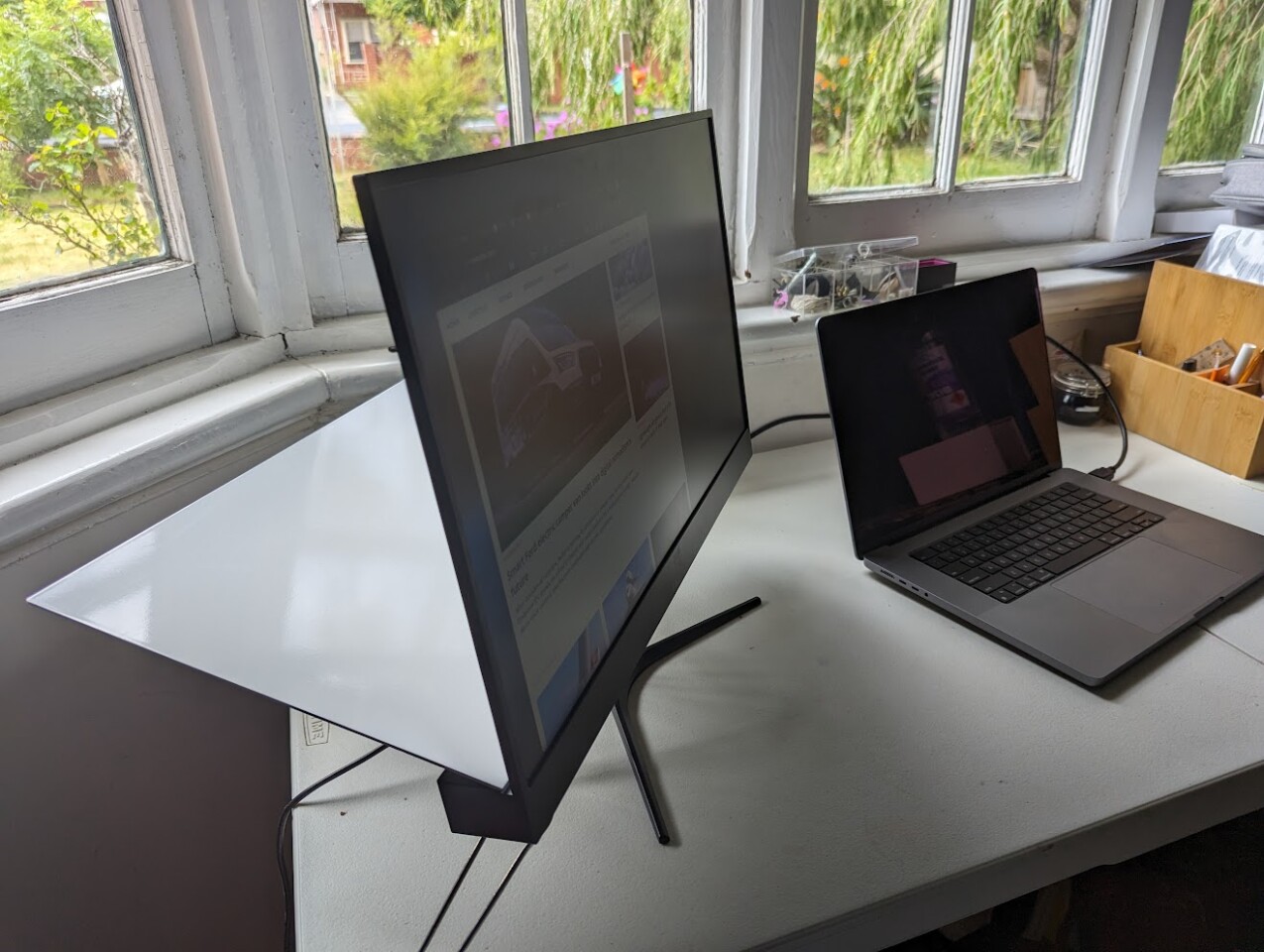 You'll need some room behind the monitor to fold out the reflector