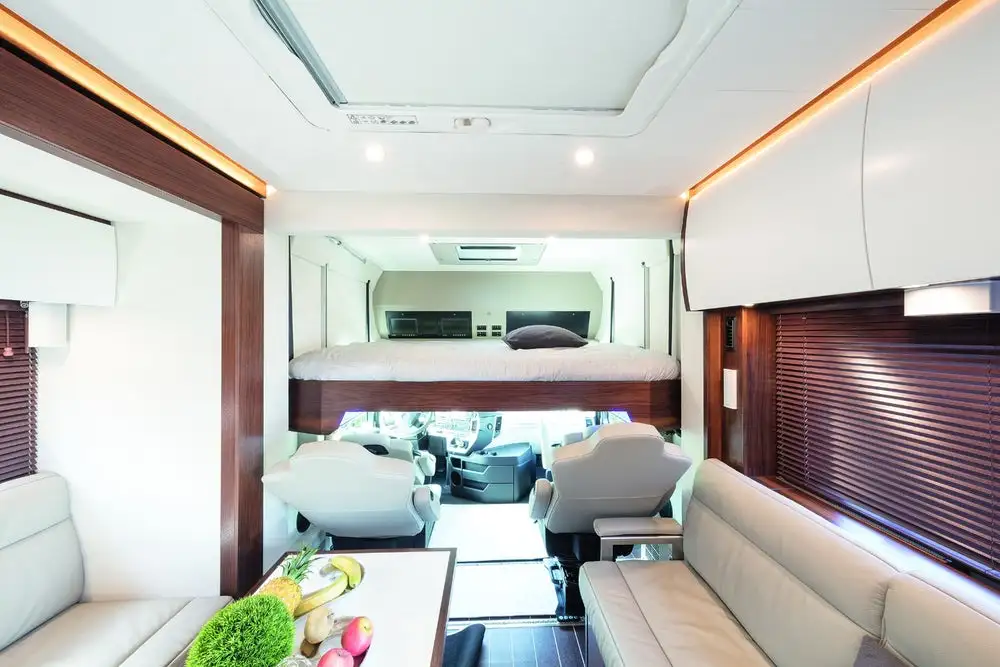 Variomobil options include a lowering bed over top the driver cab area and four driver cab seats