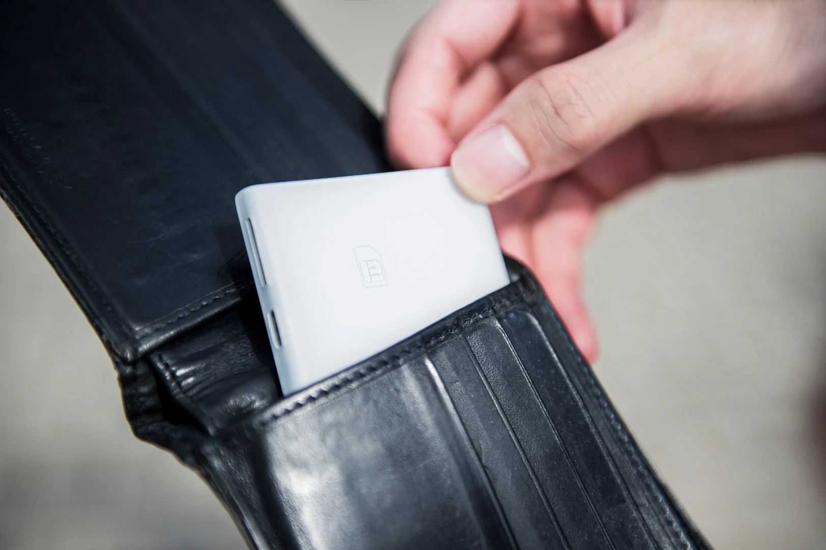 Piece is about the size of a credit card, and designed to fit inside a user's wallet or purse
