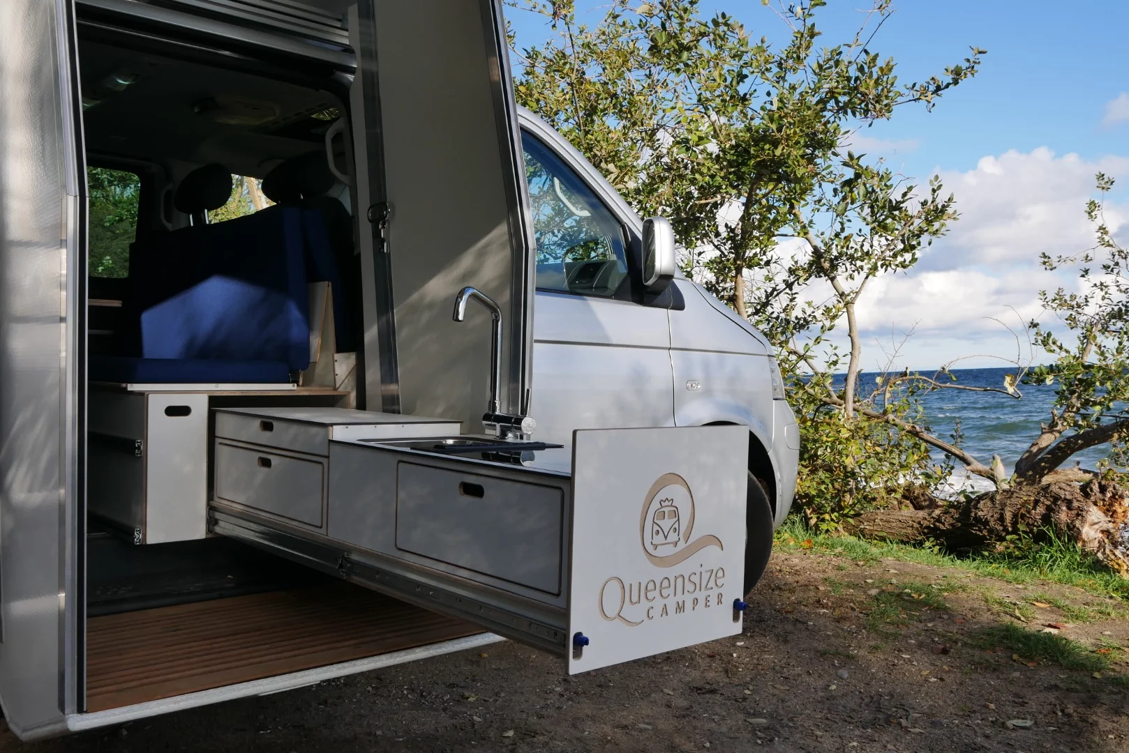 The slide-out kitchen pulls out past the drop-down entry room so campers can cook outside