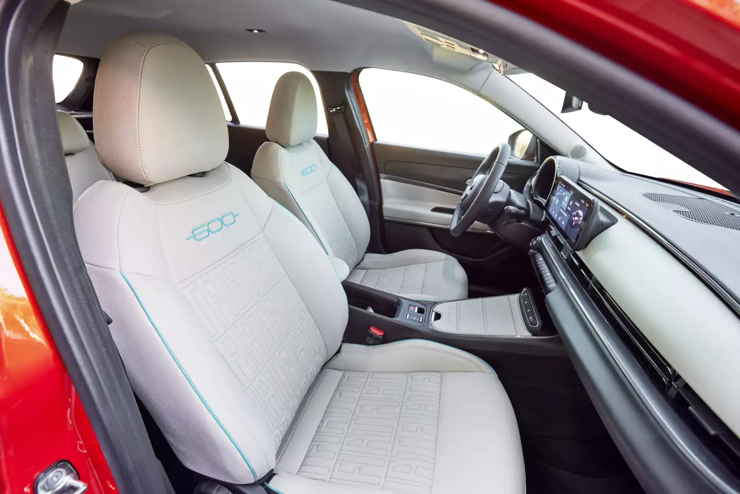 Occupants sit on Ivory-colored synthetic leather with the company monogram stitched in, while the driver gains
