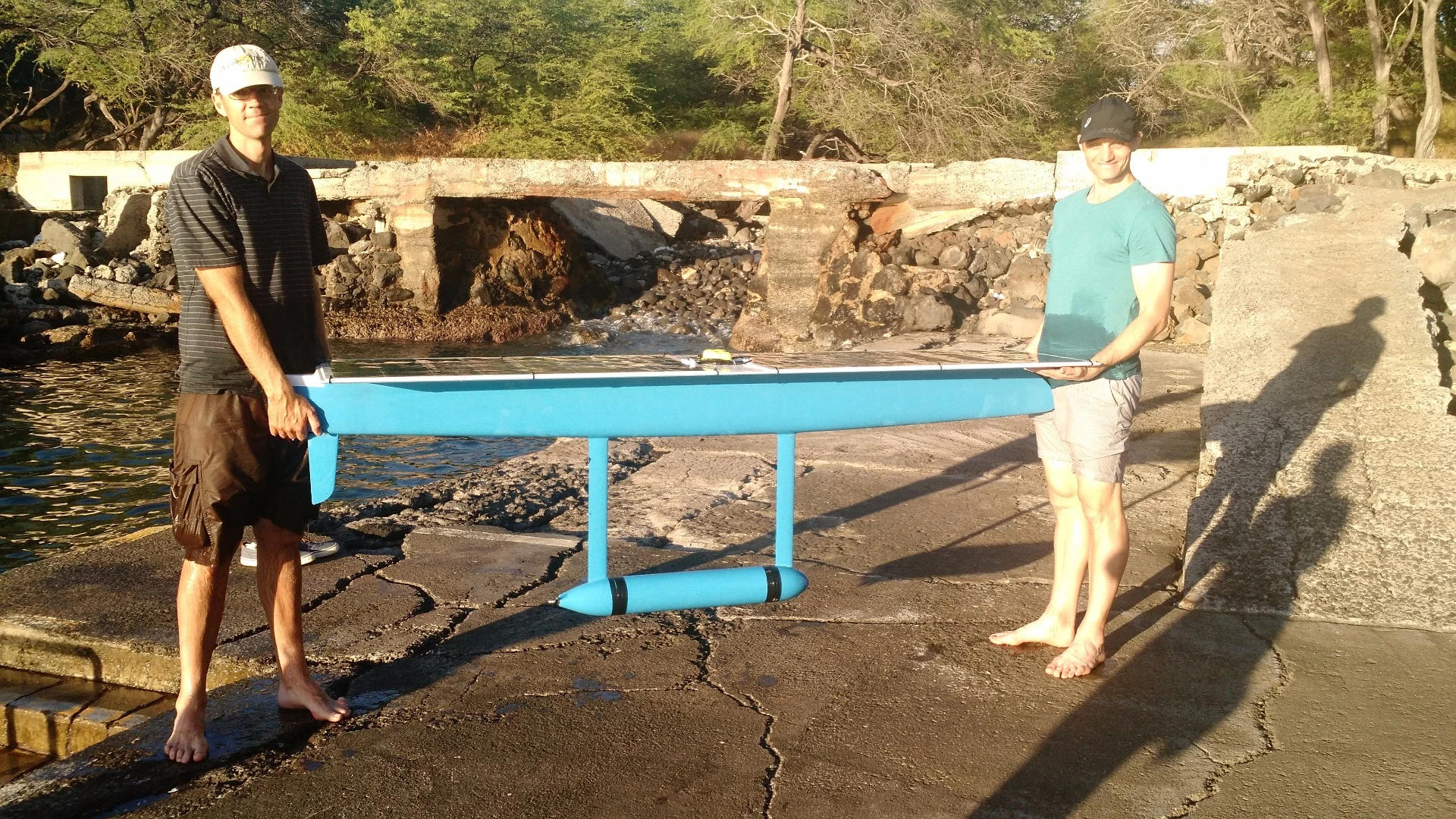A relieved Damon McMillan with his solar-powered SeaCharger in Hawaii