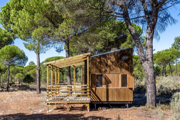 The Atlantica is a wooden tiny house located in the middle of a pine forest in Portugal, and sleeps a family of four