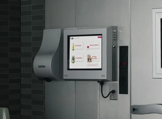 The touchscreen and scanner are next to the door of the wine vault