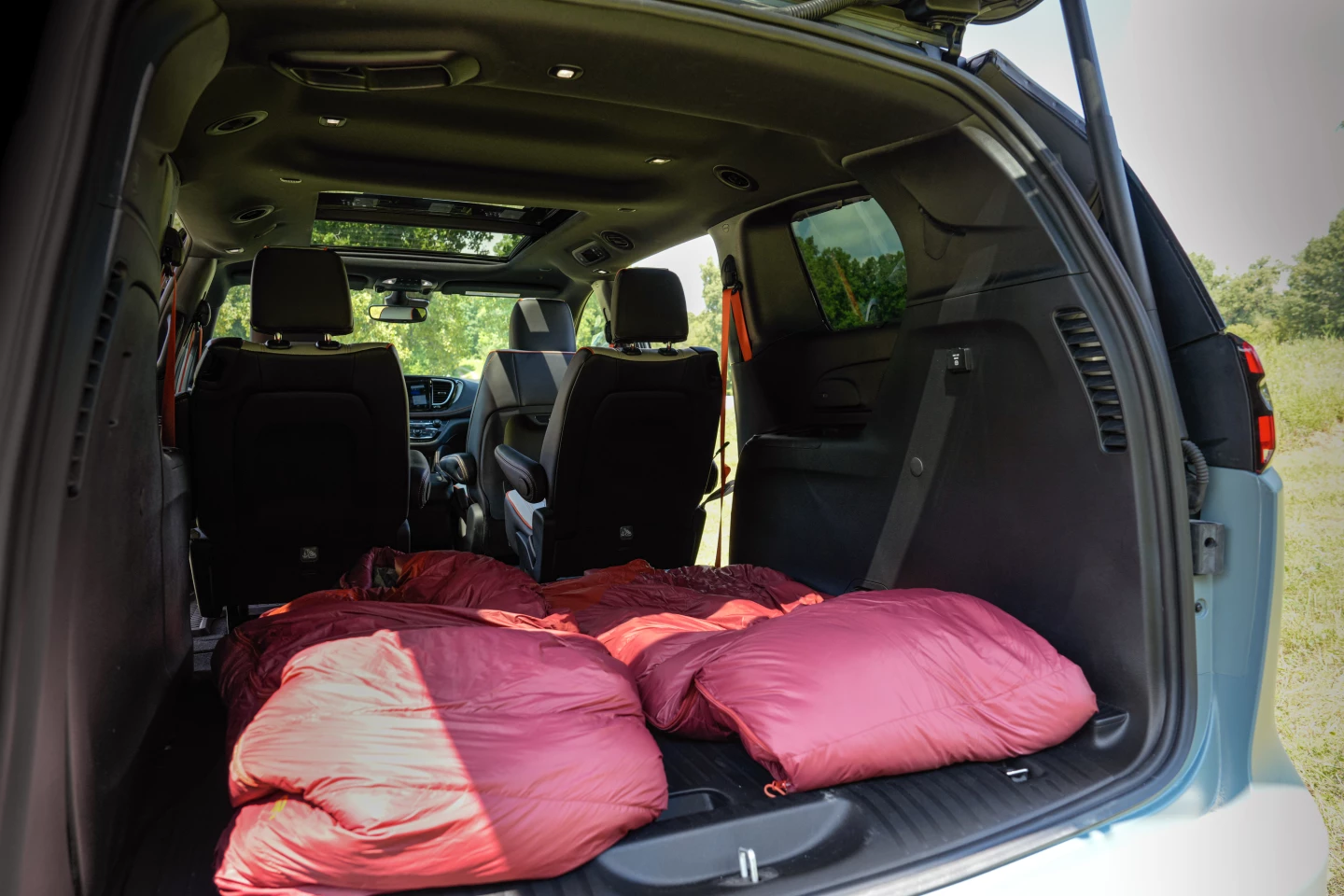 It looks a little tight here, but Pacifica solutions like removable/Stow-and-Go flat-store second-row seating can extend the sleeping area