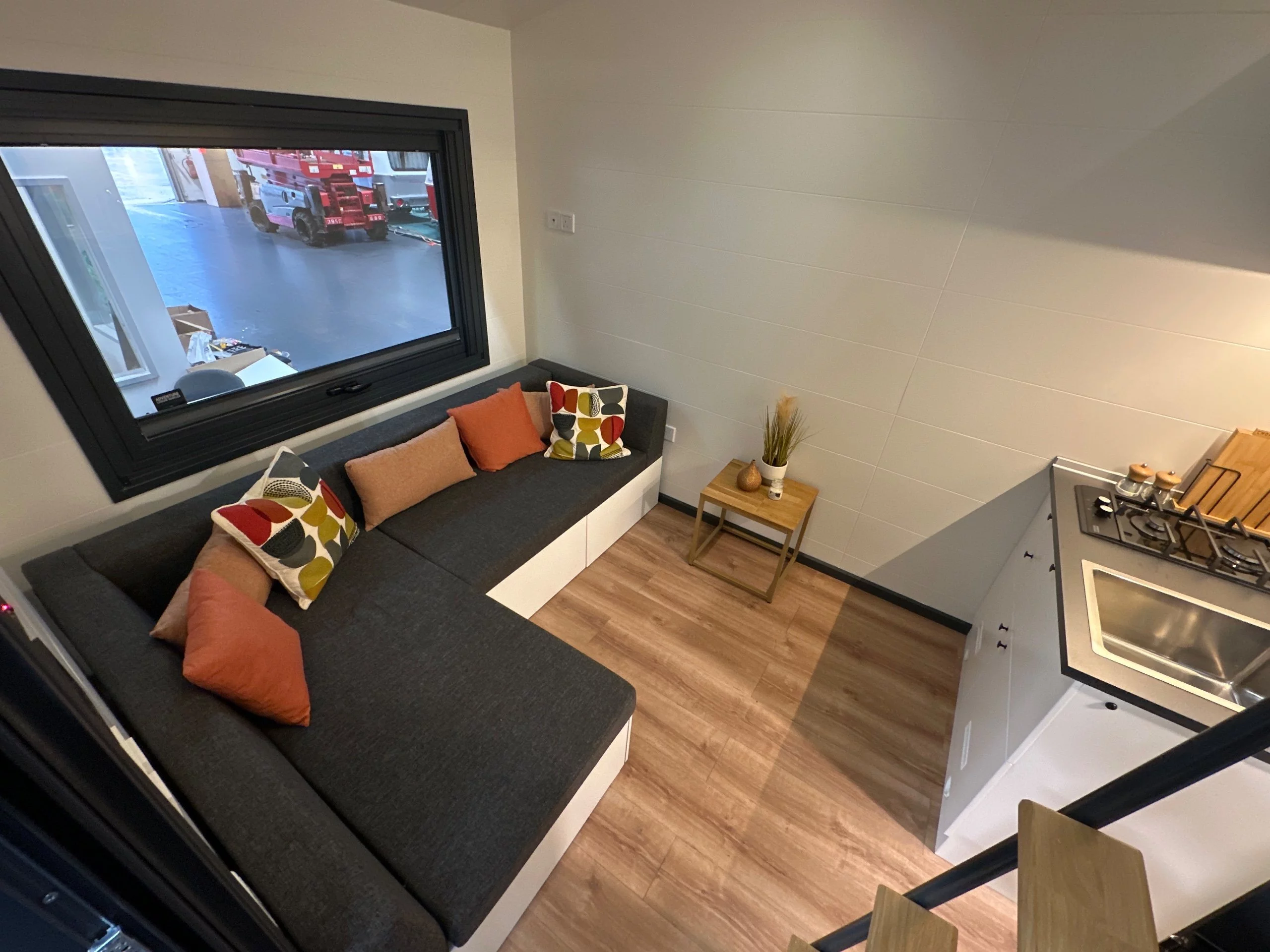 The Mo.5 450's living room is snug and includes an L-shaped sofa bed that sleeps two