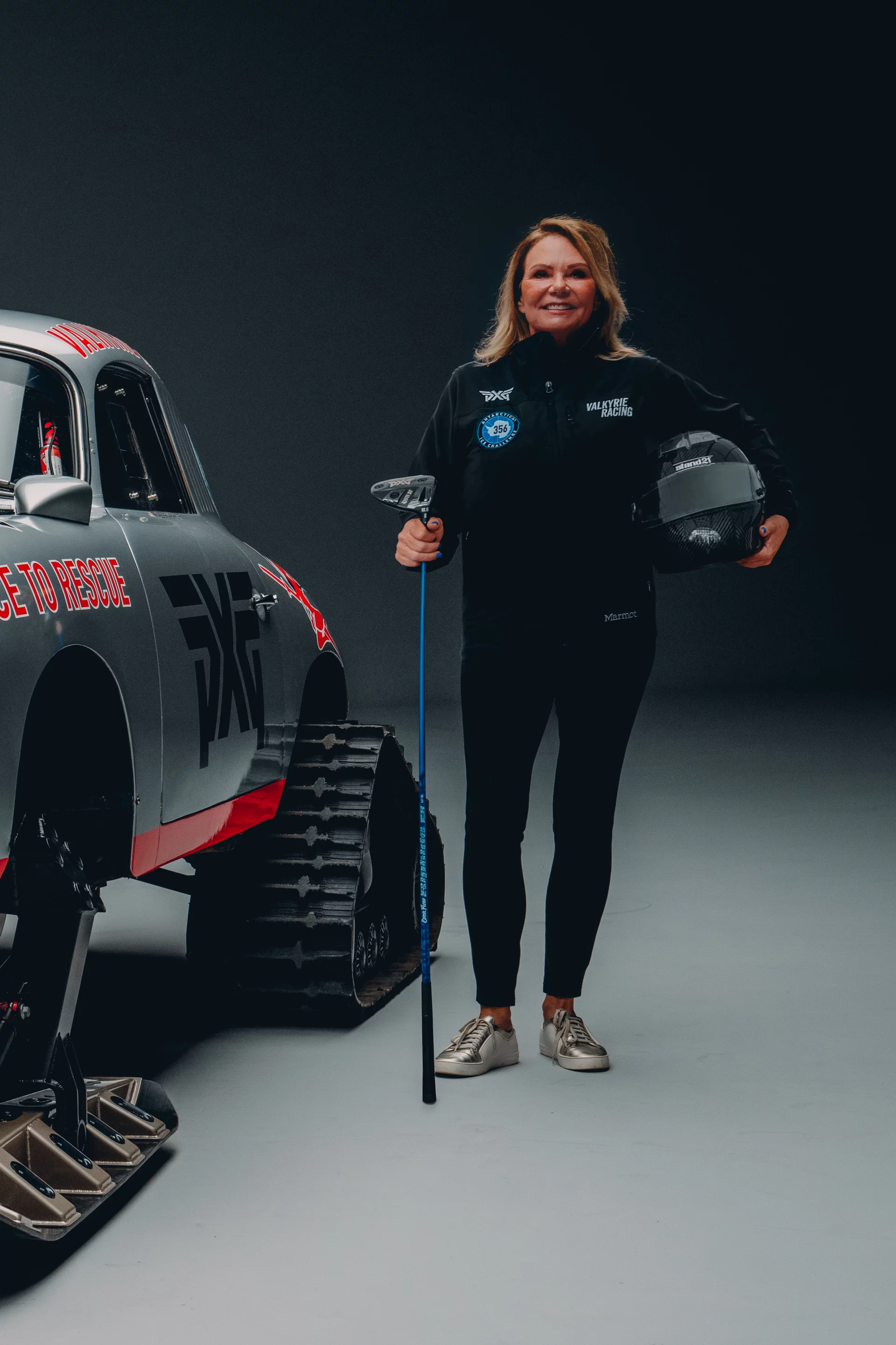 Renee Brinkerhoff poses with the Antarctic Porsche and products from PGX, a global golf research and development company that's the lead sponsor of Valkyrie's Antarctica challenge