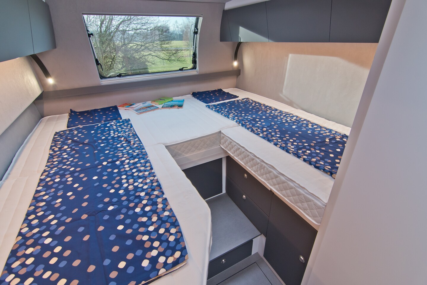 The two beds in back can join together to create a double