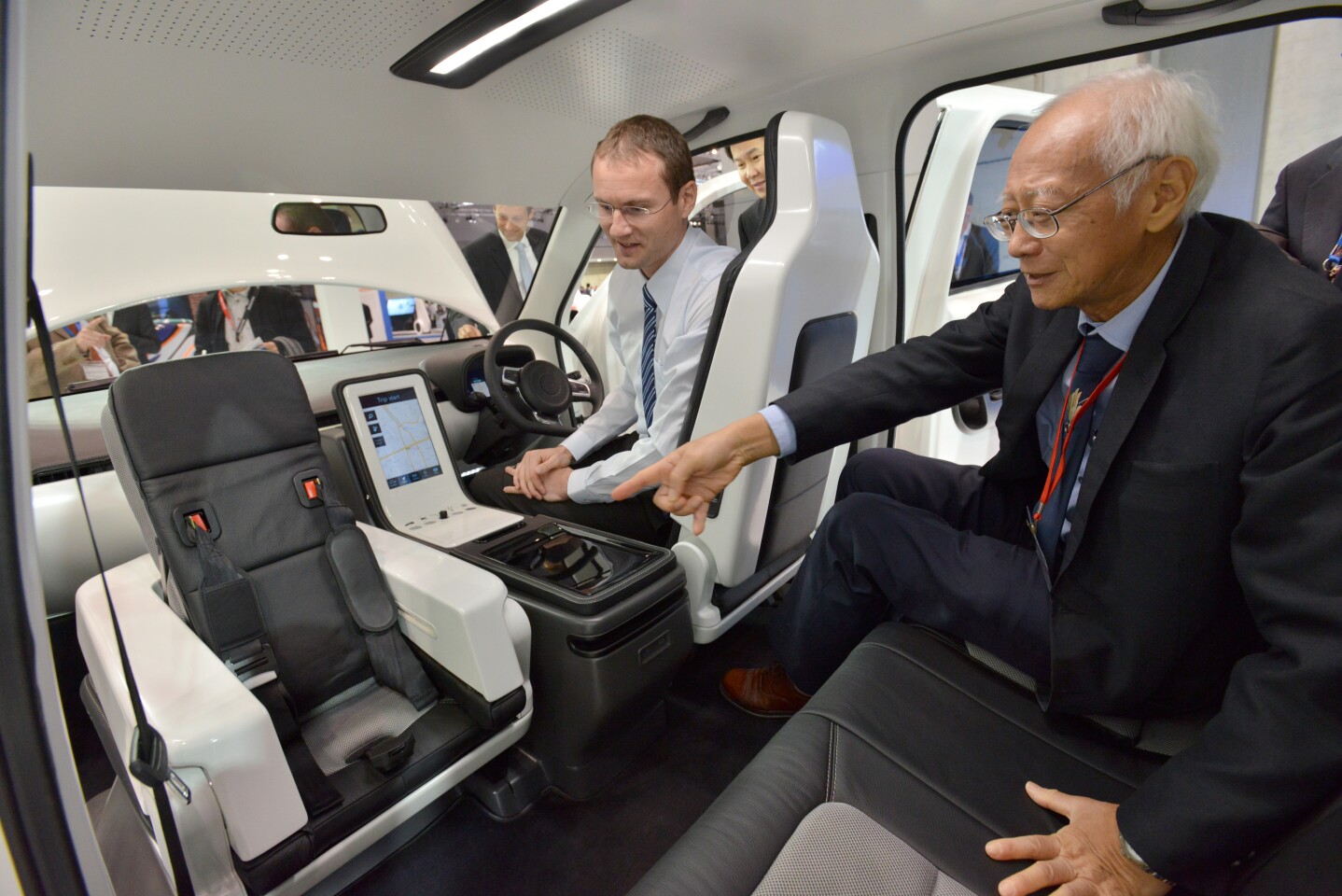 Features of the EVA taxi include a front passenger seat that folds forward to reveal an integrated child seat, and an onboard smartphone-accessible system for entertainment, booking and digital payments