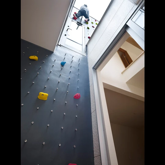 Rooftop access can be reached by the seven-meter (23-foot) climbing wall
