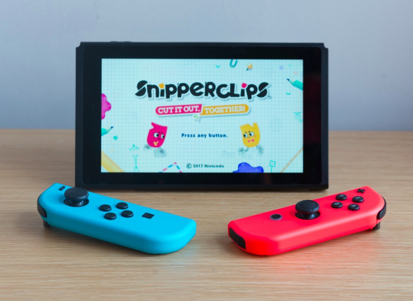 The Nintendo Switch in tabletop mode running SnipperClips