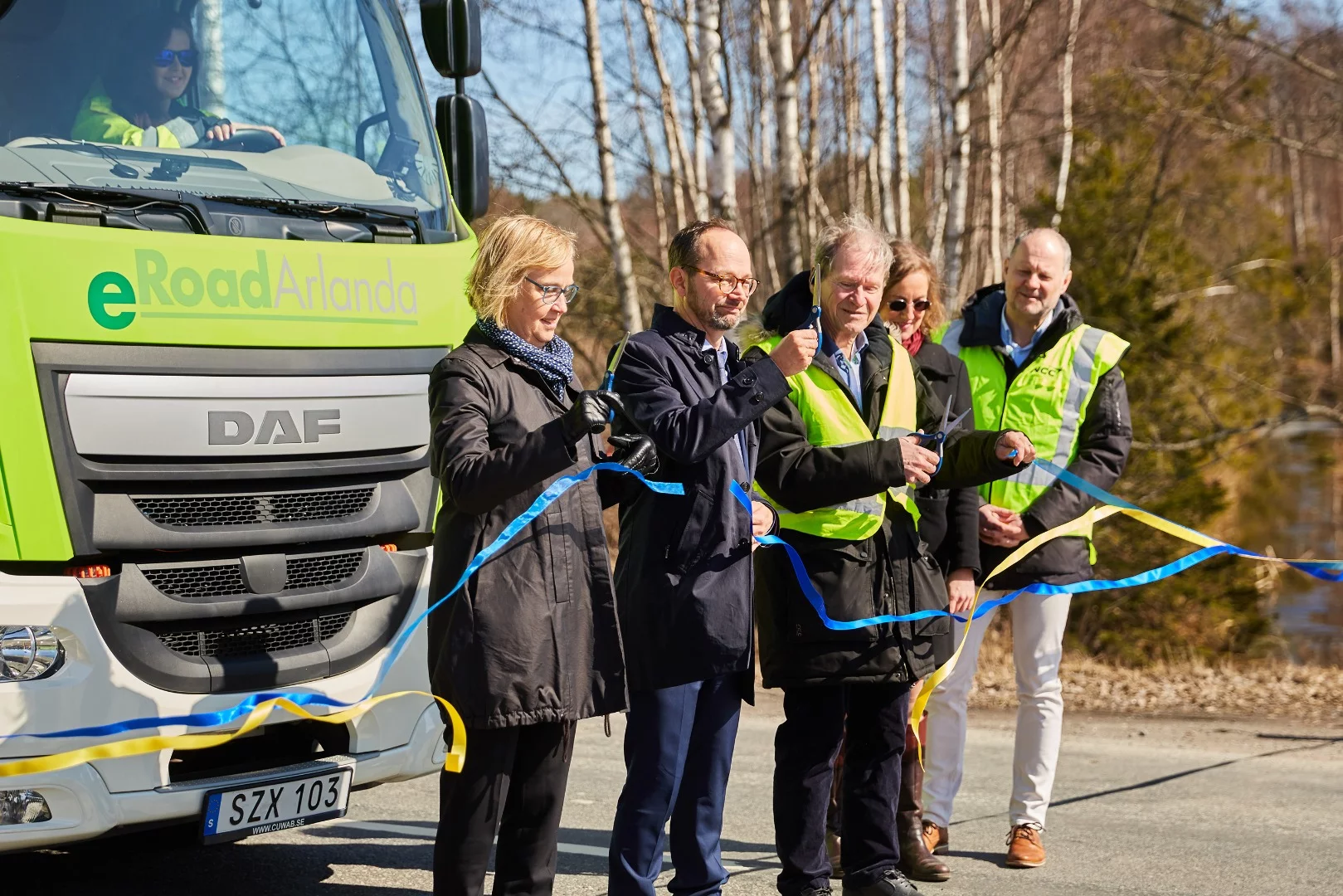 Officials cut the ribbon at the inauguration of the public section of eRoadArlanda electrified road