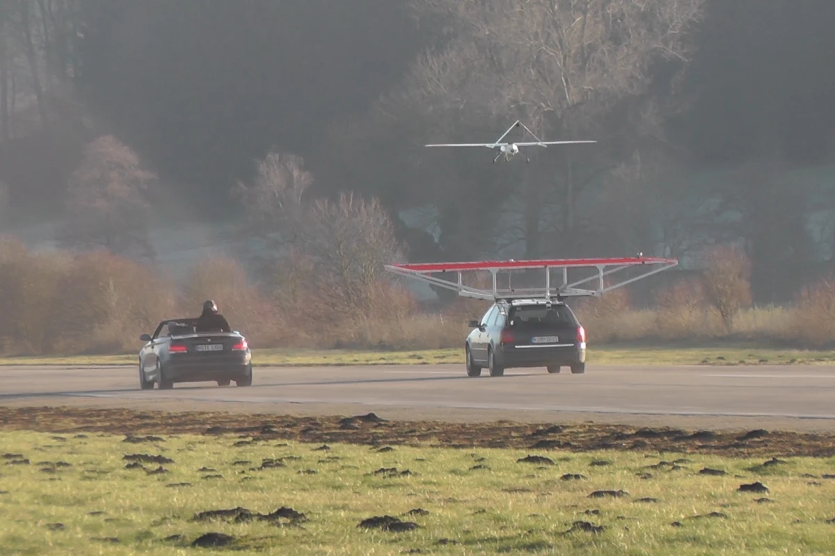 The drone coming in for an autonomous landing on a moving vehicle