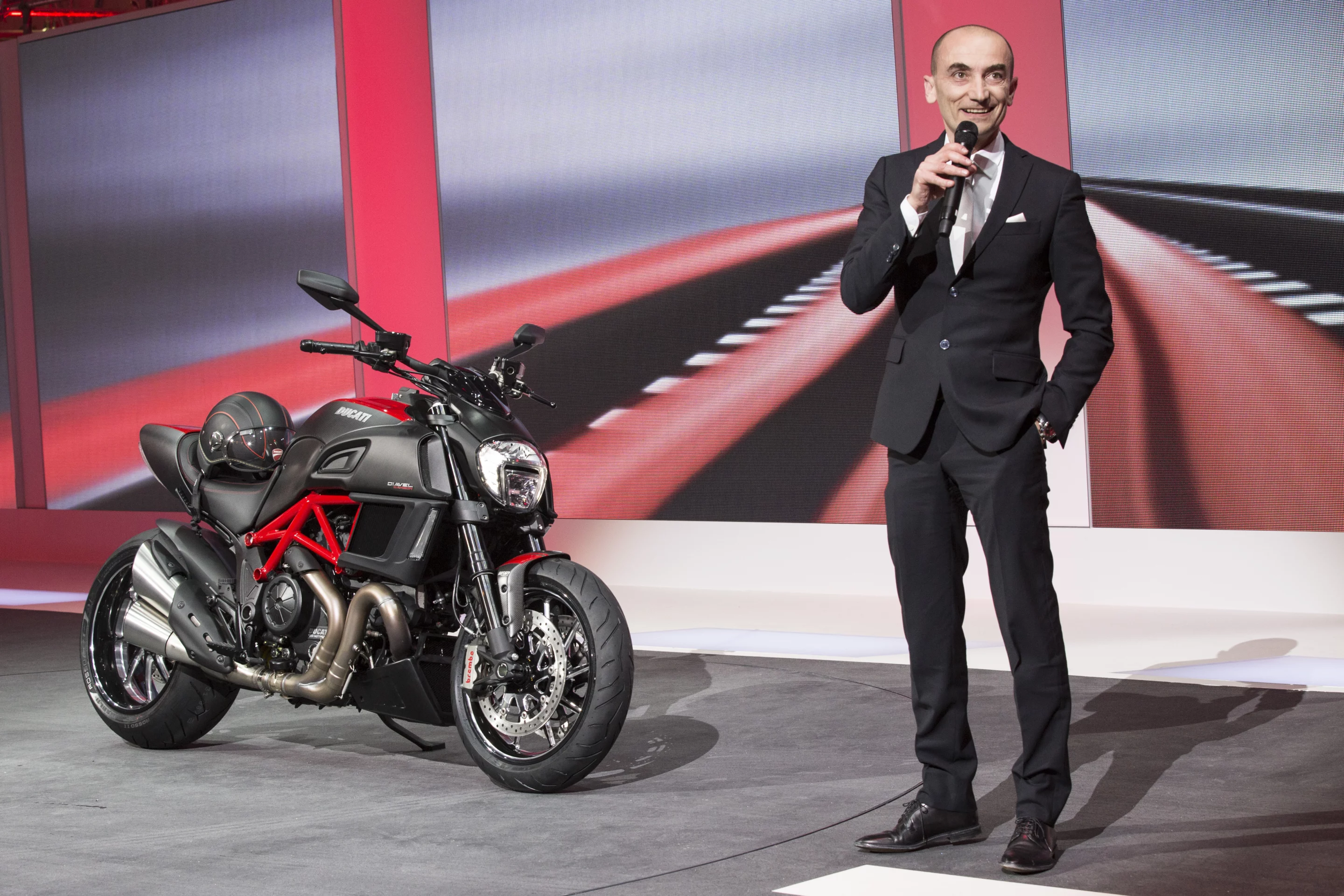 Ducati's CEO Claudio Domenicali introduces the key features of the Diavel Carbon to the assembled world automotive press during Volkswagen Group Night on the eve of the 84th International Geneva Motor Show.