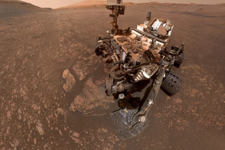Curiosity took this selfie on May 12. The two drill holes in the clay-bearing region can be seen to its lower left