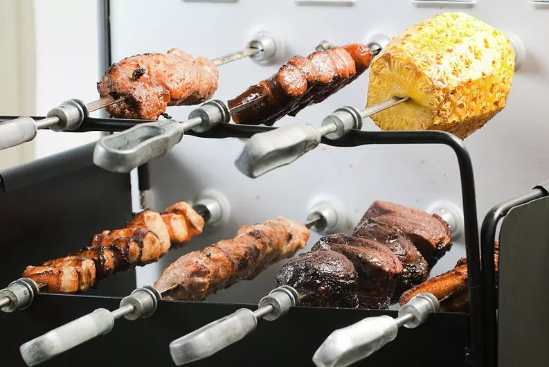 The Carson Portable Rotisserie Grill can rotate up to seven skewers at once