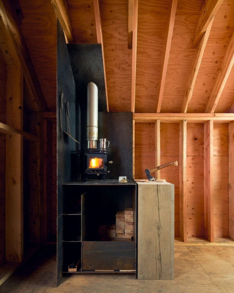 The Site Shack includes a wood-burning stove