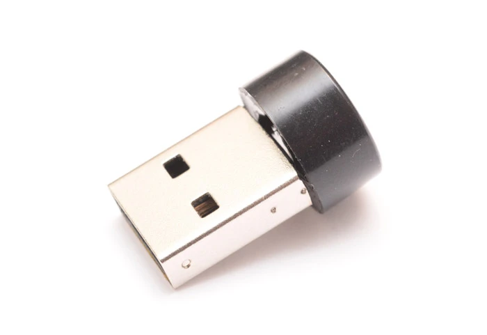 The circuitry is hidden beneath the metal housing, which is attached to a piezo buzzer