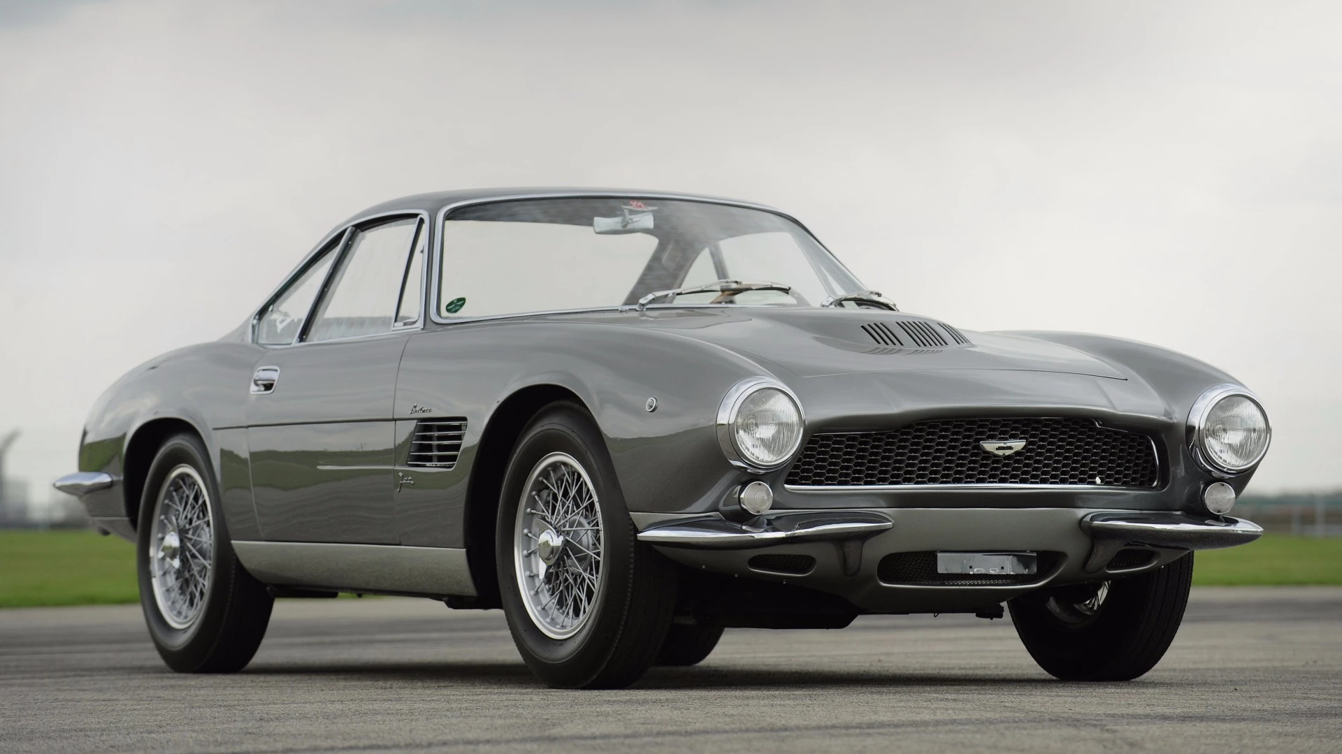 The DB4 GT was a lighter, higher-performance version of the DB4 introduced in September 1959, and timed at 152 mph (245 km/h) by Autosport in December 1961. The aluminium body was thinner, the wheelbase was shorter, and the range-topping 3750 cc engine produced 302 hp. The car above is the final GT off the production line, the bespoke 1960 DB4GT 'Jet' Coupe which sold at a Bonhams auction at Aston Martin's Newport Pagnell facility in May, 2013, for £3,249,500. Bertone built the Gran Turismo version for the 1961 Geneva Motor Show and that's it above. The car was the work of a young Giorgetto Giugiaro and was shown at the same Geneva show which was marked by the debut of Jaguar's new E-type.