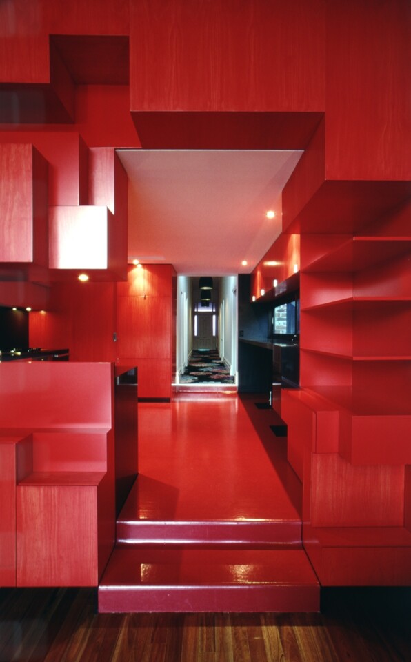 Nested within the cloud-shaped extension is a red cube: the Cloud House's new kitchen