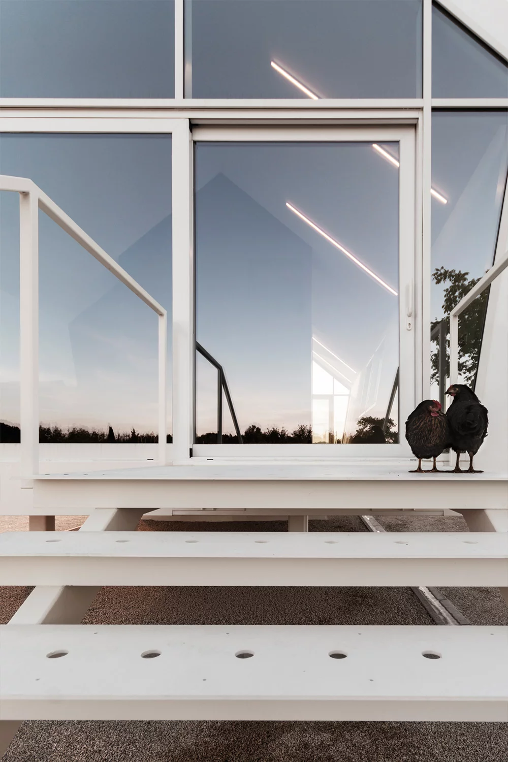 A steel staircases provide access to the home