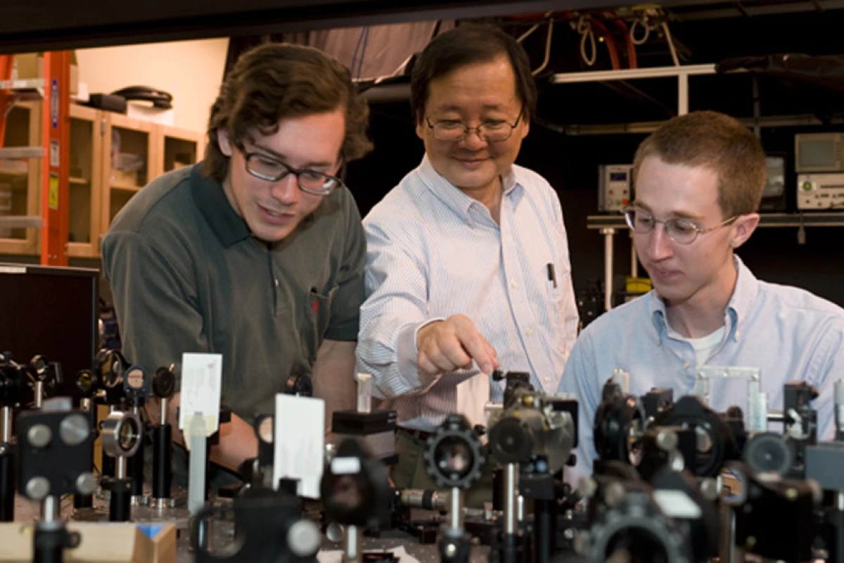 WSU chemist Choong-Shik Yoo, seen here with students, has used super-high pressures to create a compact, never-before-seen material capable of storing vast amounts of energy (Credit: WSU)