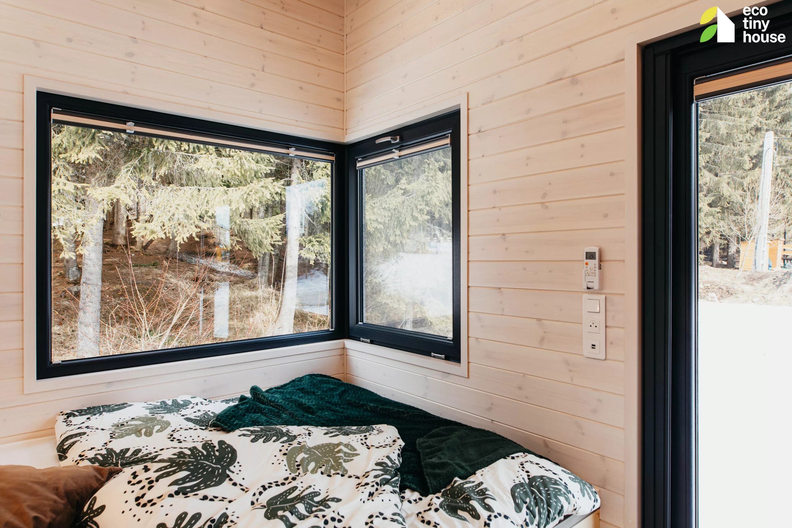 The Tiny Rubik's interior looks light-filled thanks to its generous glazing, and the living area has a high ceiling