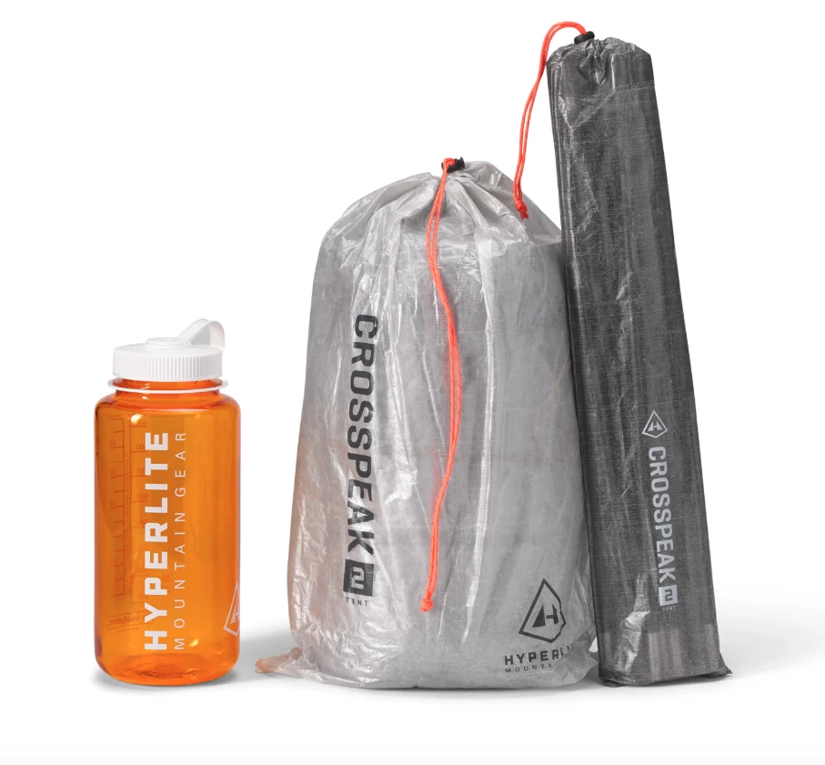 Right to left: Crosspeak 2 poles in DCF sack, tent fabric in DCF sack and water bottle for comparison