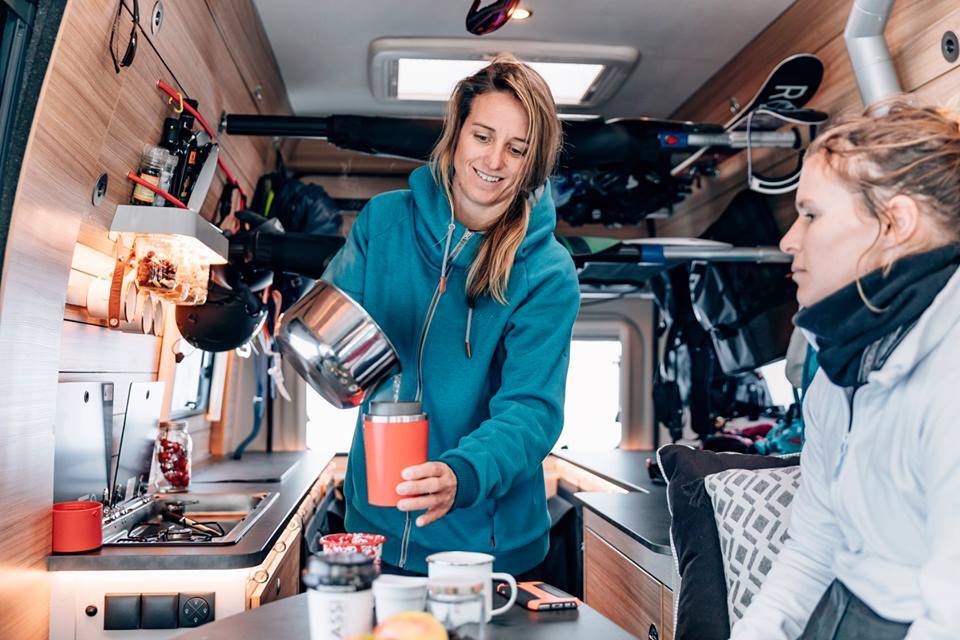 The passenger-side kitchen is the start of a long countertop that extends back to the rear door, offering work space and a support for the inflatable SUP mattresses