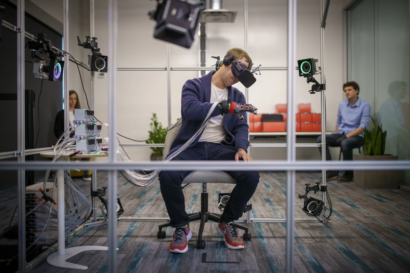 Mark Zuckerberg gets to grips with a haptic glove prototype