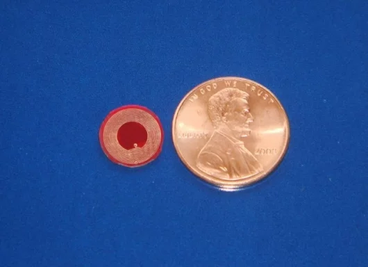 Battery-free RFID sensors smaller than a penny