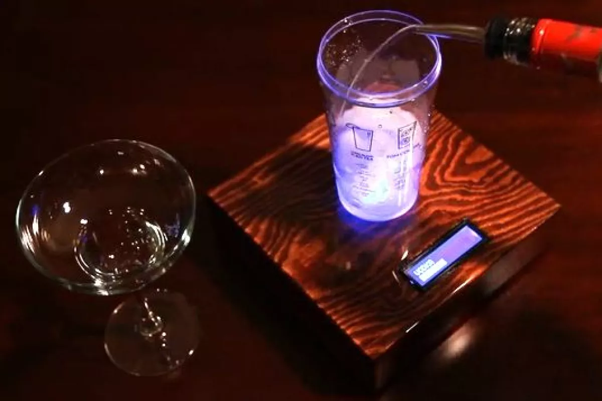 The Barman guides users through the drink-making process by weighing the added ingredients