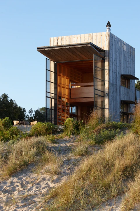 The enormous front shutter opens up the entire front facade to the sea (Photo: Jackie Meiring)