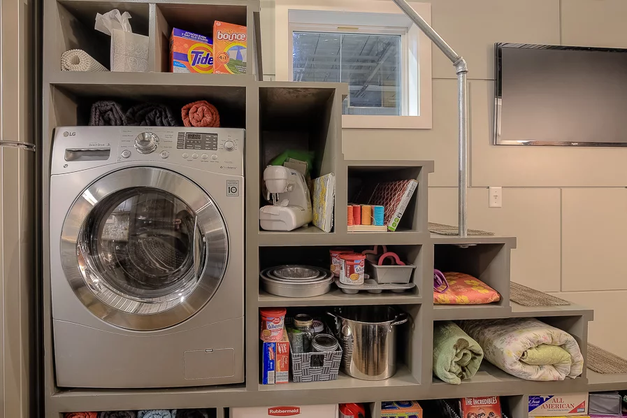 The washer/dryer is built into the storage-intergrated stairs