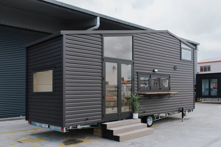 The Hilltop Tiny House features a steel frame and is finished in vinyl cladding