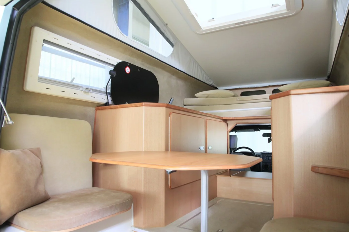 Two seats and an adjustable table make up the dining room