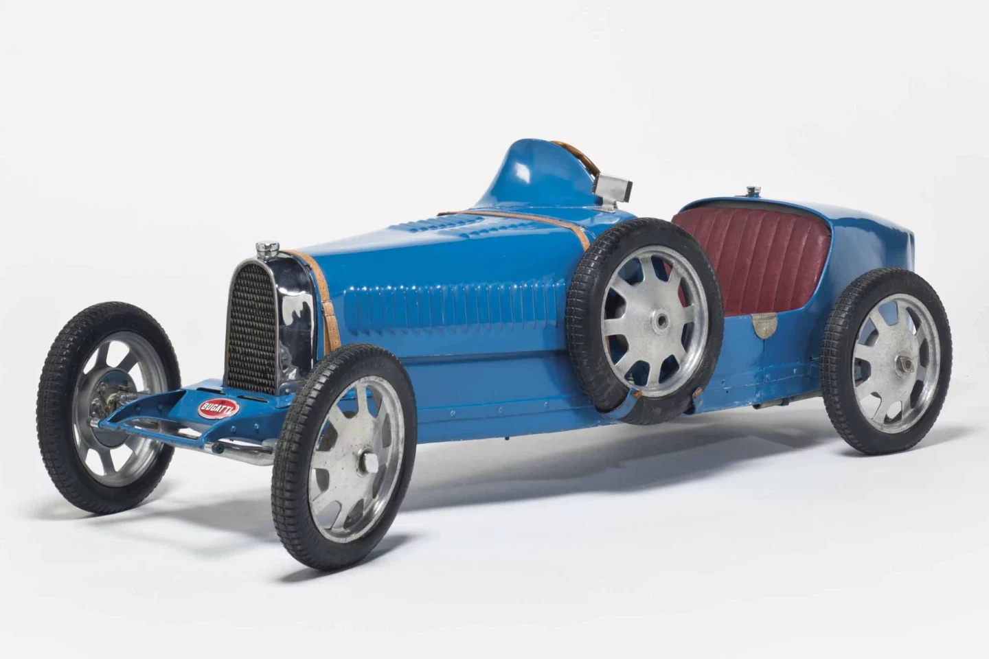 Bugatti Babys are by far the most valuable children’s cars, accounting for 12 of the 15 most expensive children’s cars that have been sold at auction. The car pictured is the most expensive Bugatti Baby ever sold. Unlike most Bugatti Babys that are sold at car auctions, the most valuable children’s Bugatti fetched EUR€111,900 (US$124,962) at a Christie’s fashion auction in Paris in 2015. The car is one of four that were originally in the collection of Fritz Schlumpf. Two of those cars are now in the La Cité de l'Automobile (French National Automotive Museum) in the Collection Schlumpf in Mulhouse. The fourth "short chassis" Bugatti Baby from the Schlumpf collection was sold during the Estate sale of Arlette Schlumpf by Gasser Audhuy in 2009 for €65,000 (US$90,929).