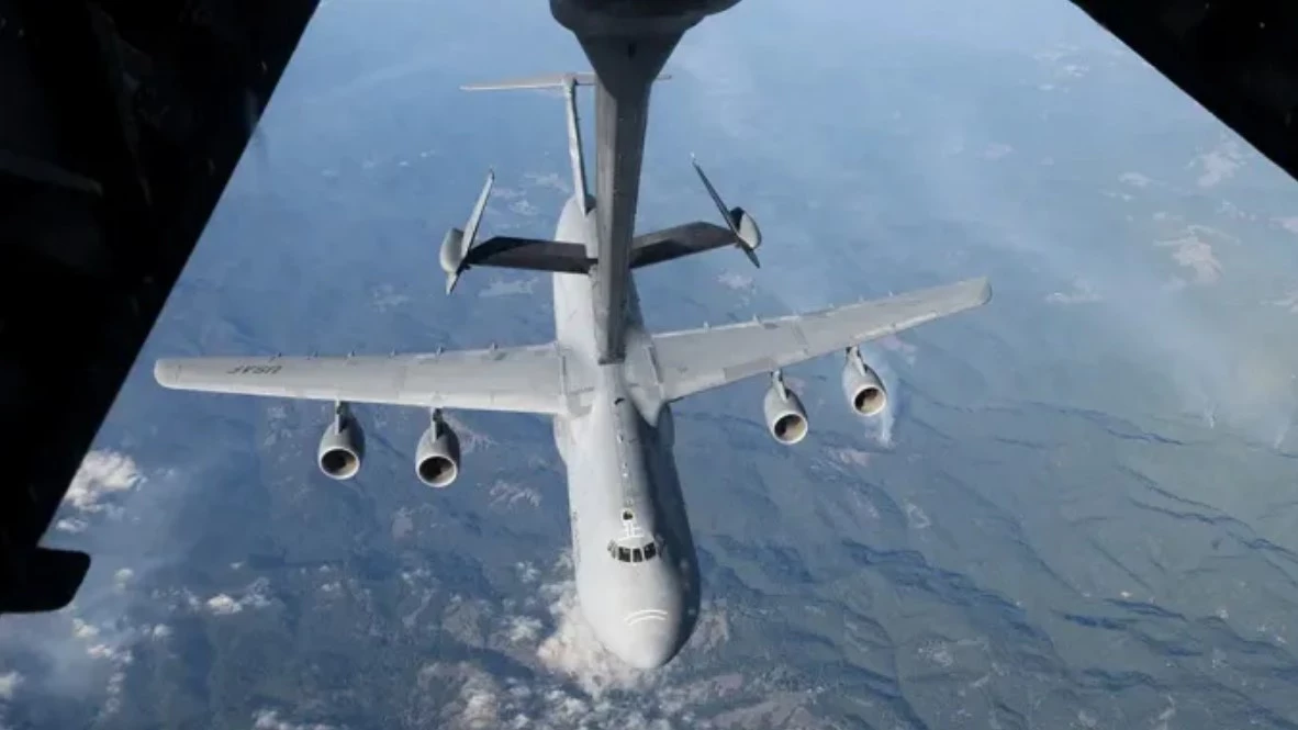 A C-5M transport aircraft prepares to refuel a refueling tanker